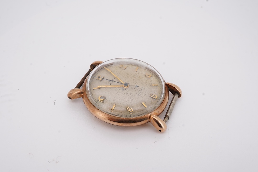 A gentleman's 1940's? 9ct gold Rolex manual wind wrist watch, with signed Super Balance movement, the inner case back numbered 4411 over 844, case diameter 34mm, no strap or winding crown. Condition - poor